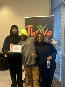 Youth Spotlight and family with certificate